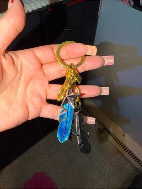 Coach Gold Keyring with Blue and Black Feather Charms